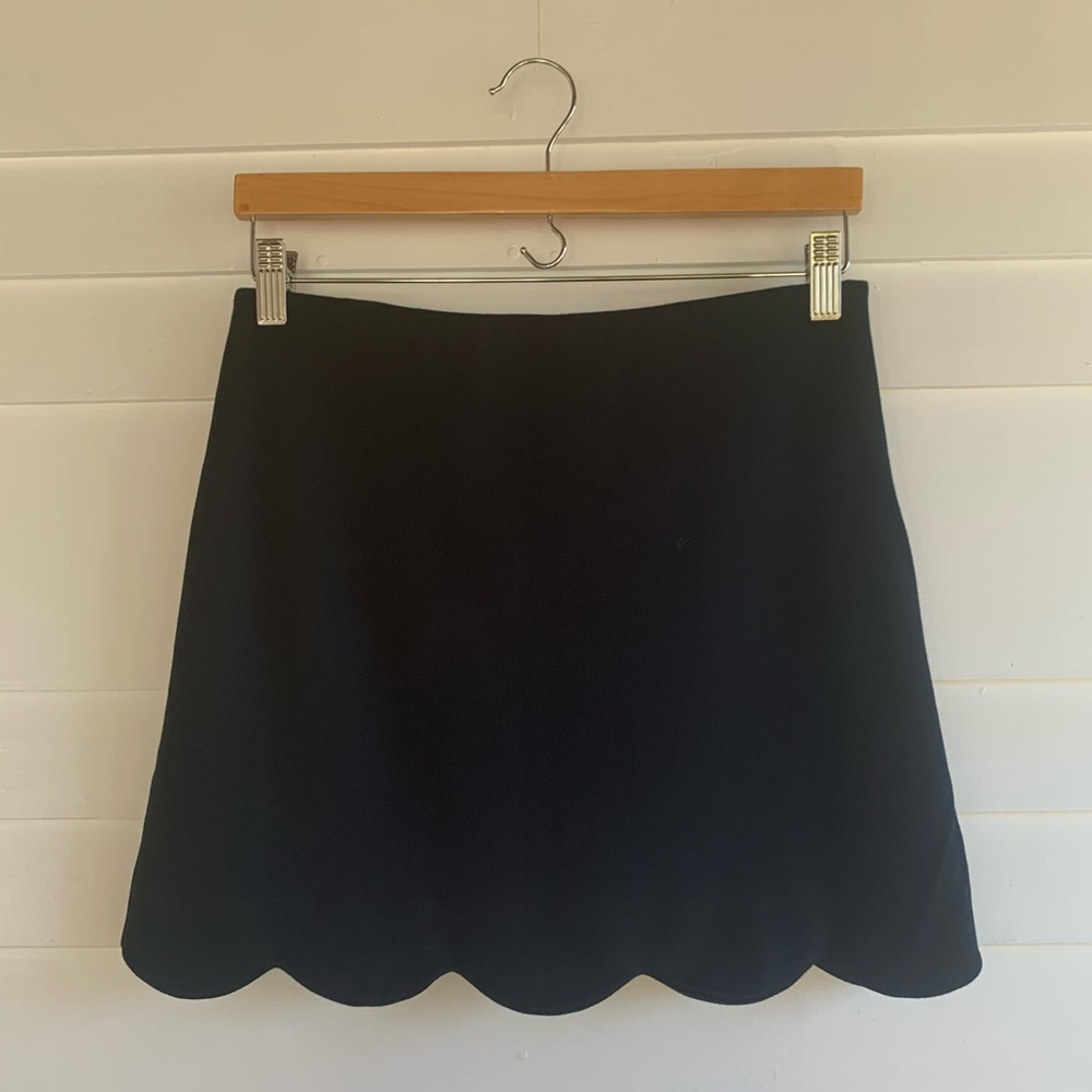 Scalloped black mini skirt